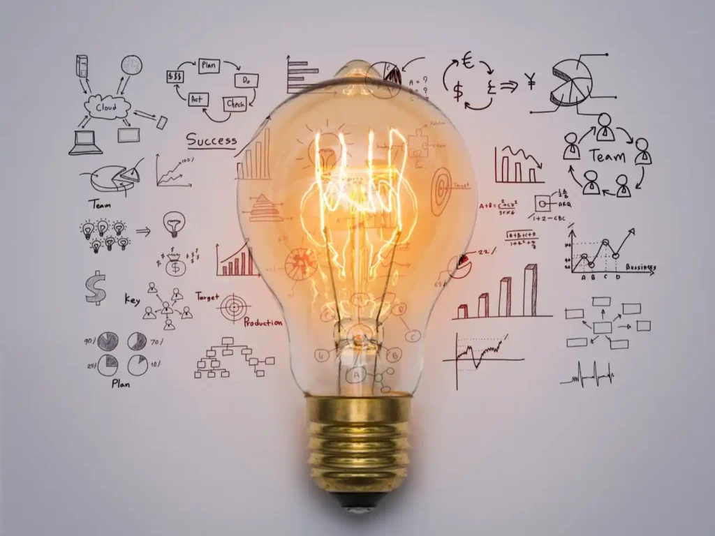 Light bulb with business ideas sketched on it, symbolizing energy monitoring benefits for homes and businesses